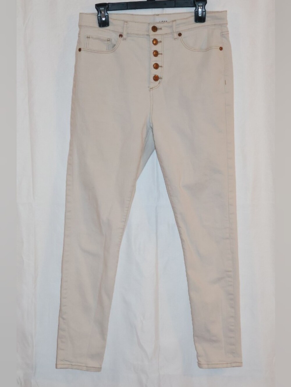 LOFT Cream/Off-White High-Rise Button-Fly Skinny Jeans.